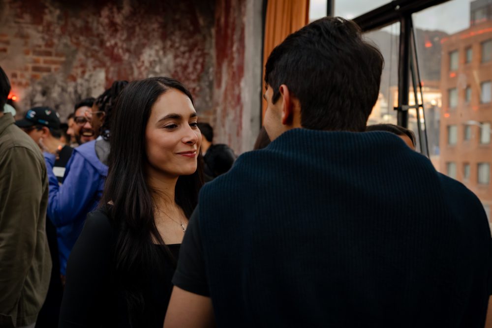 In conversation at a rooftop founder event