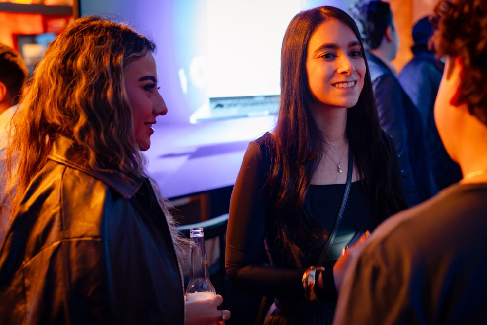 Talking with founders at an evening event